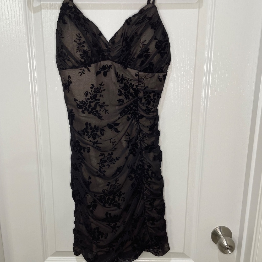 black bodycon dress with floral detailing